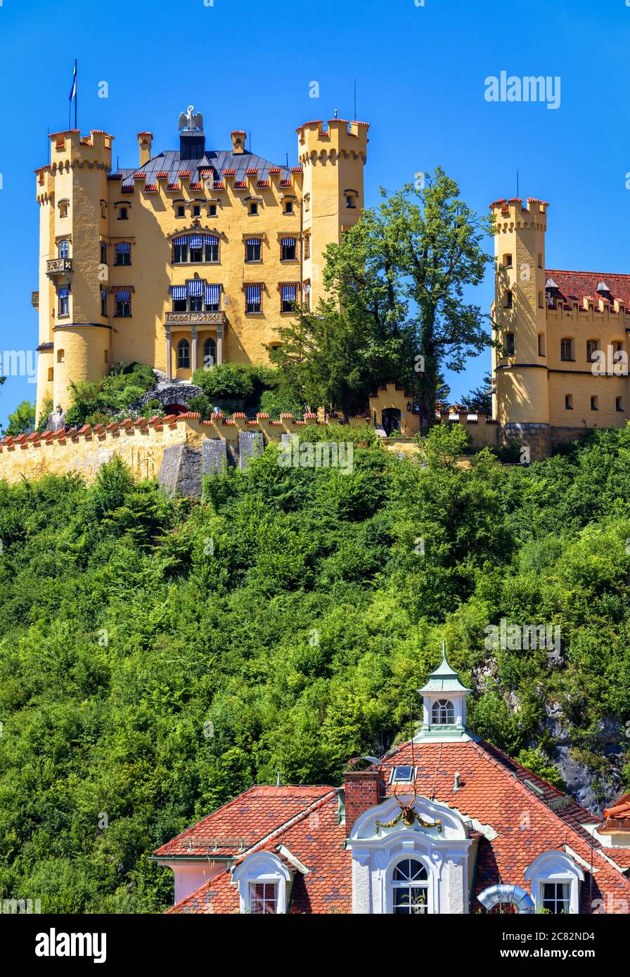 Hohenschwangau Castle near Fussen, Bavaria, Germany. Schloss Hohenschwangau is landmark of German Alps. Scenic view of famous castle on hilltop in sum Stock Photo