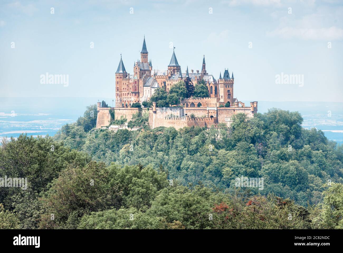 Hohenzollern Castle in summer morning, Germany. It is famous landmark in Stuttgart vicinity. Landscape with fairytale Gothic castle like palace. Sceni Stock Photo