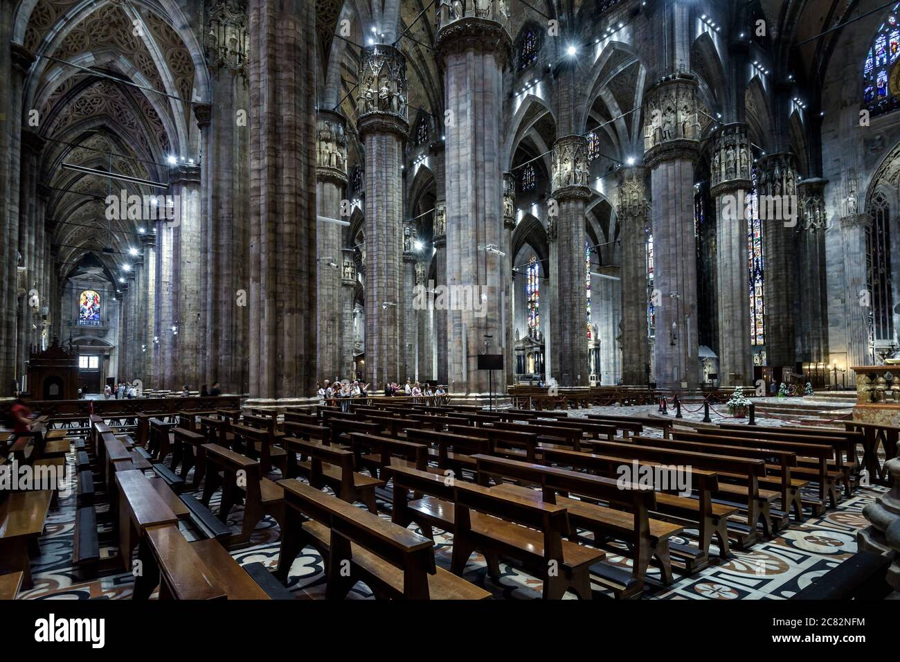 Milan, Italy - May 16, 2017: Interior of large Milan Cathedral or Duomo di Milano. It is great Catholic church, top landmark of Milan. Inside dark Got Stock Photo