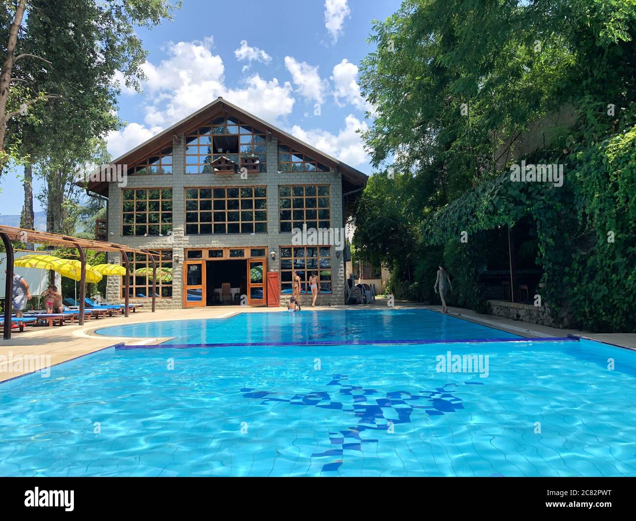 Albanian traditional stone house with swimming pool Stock Photo Alamy
