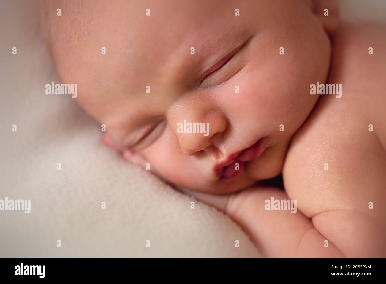 Close up of newborn baby boy sleeping Stock Photo