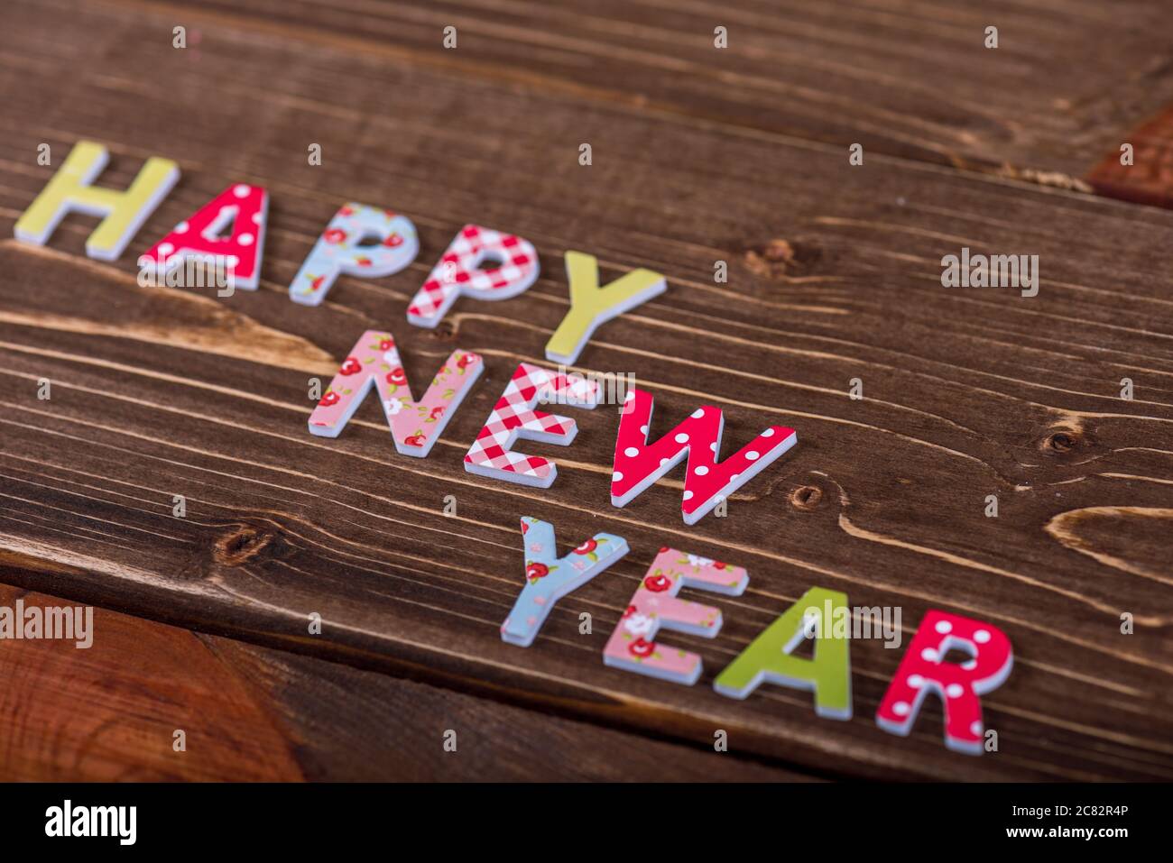 Wood inscription Happy New Year on wood board Stock Photo - Alamy