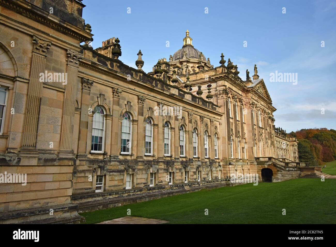 The South Front of Castle Howard. An historic stately home in North Yorkshire, England, on a bright sunny day. Green grass and blue sky. Stock Photo