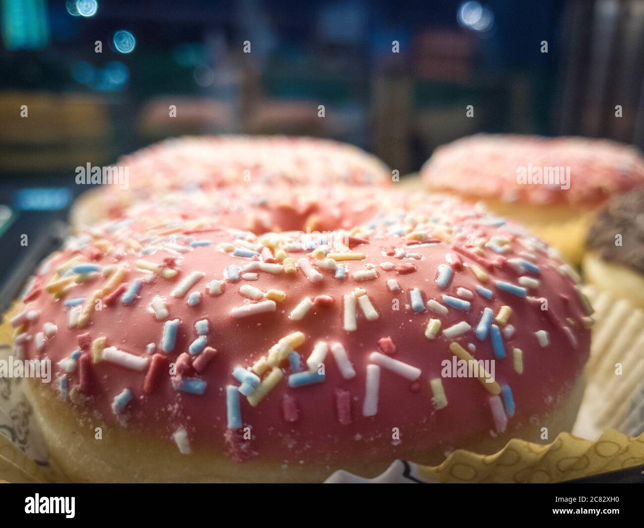 Closeup shot of delicious donuts with sprinkles on top Stock Photo - Alamy