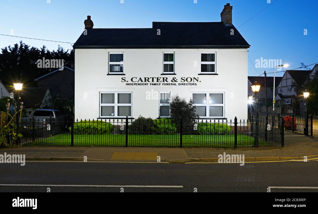 A late evening view of the S Carter & Sons premises in the London Road, Wickford, on the corner with Irvon Hill Stock Photo