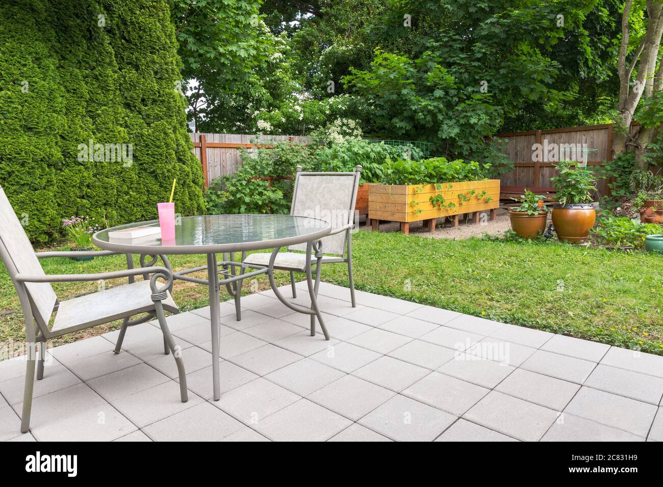 Backyard Patio Garden With Patio Furniture And Raised Garden Beds Stock Photo Alamy