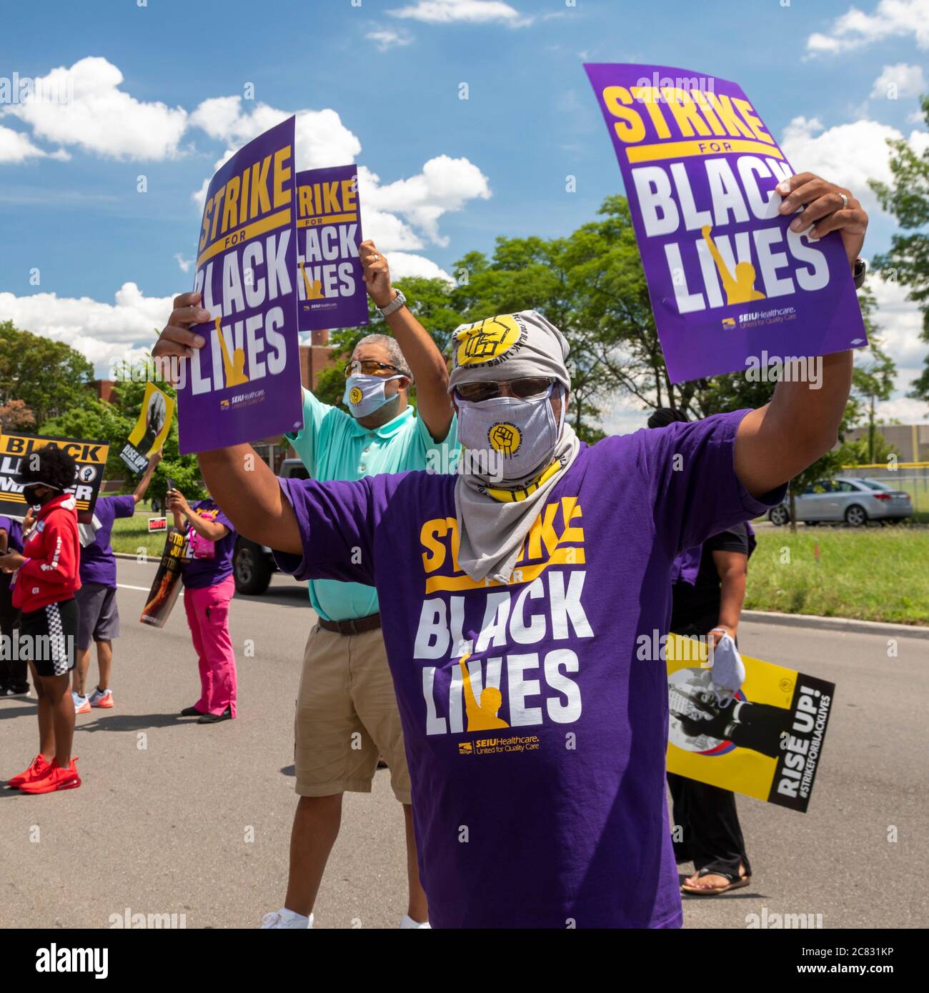 Detroit, Michigan, USA. 20th July, 2020. Nursing home workers rally outside Hartford Nursing and Rehabilitation Center during the nationwide 'Strike for Black Lives.' The strikers, members of the Service Employees International Union, were supported by Teamsters and other union members. SEIU says more than 50,000 nursing home residents and workers have died from Covid-19 during the pandemic. Credit: Jim West/Alamy Live News Stock Photo