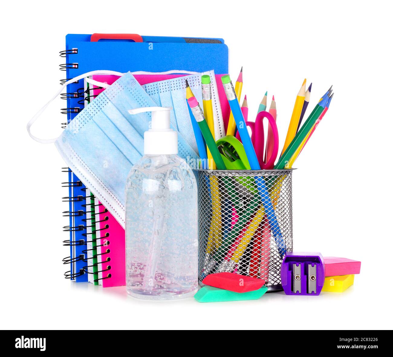 Group of school supplies and COVID 19 prevention items isolated on a white background. Back to school during pandemic concept. Stock Photo