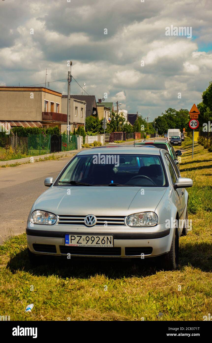 GADKI, POLAND - Jun 24, 2014: Silver Volkswagen Golf parked on green grass  by a road Stock Photo - Alamy