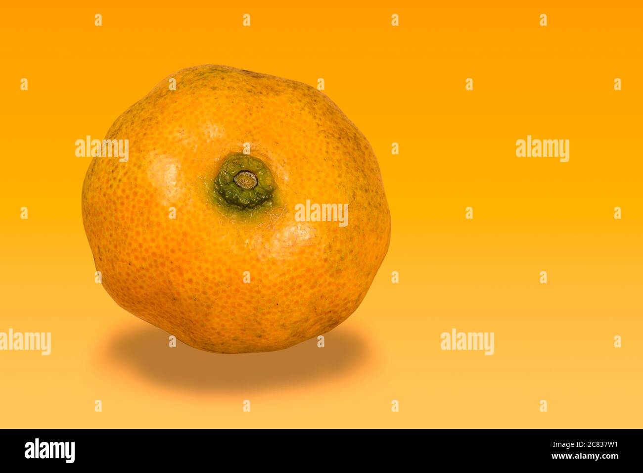 Fresh mandarin oranges fruit or tangerines in a orange back ground Stock Photo