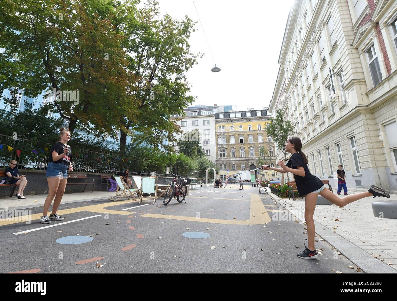 Vienna, Austria. 20th July, 2020. Two girls play badminton on a "cool  street" set up on Waltergasse in Vienna, Austria, July 20, 2020. In 2020,  Vienna has set up 22 "cool streets"
