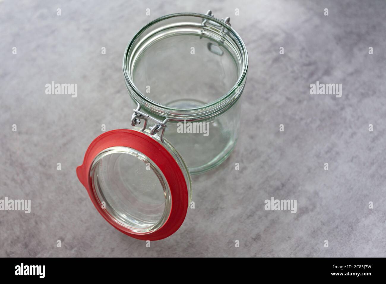 Closeup shot of a glass bank on a grey table Stock Photo