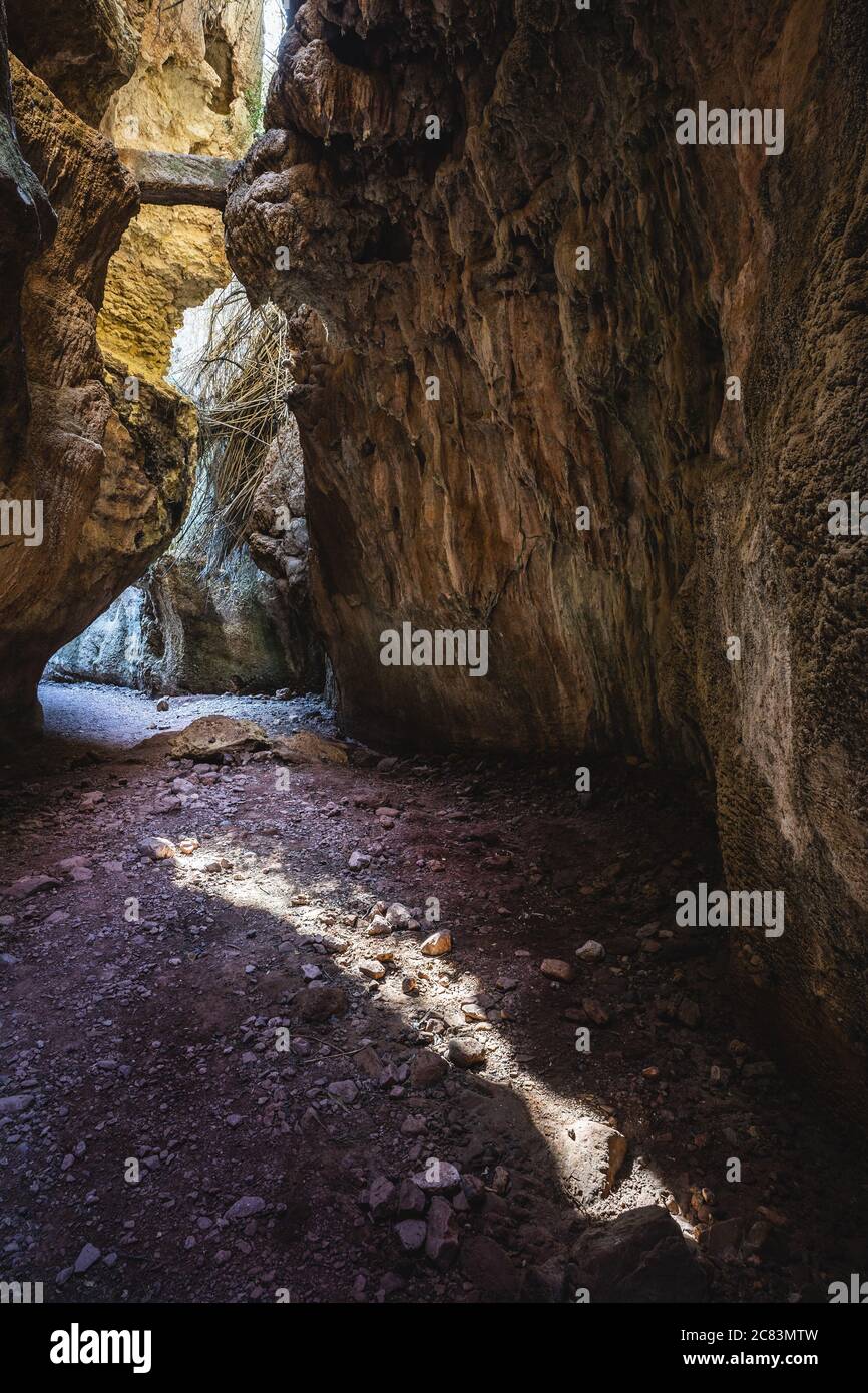 Path Between The Rocks Breathtaking view of the narrow path between the enormous rocks Stock ...