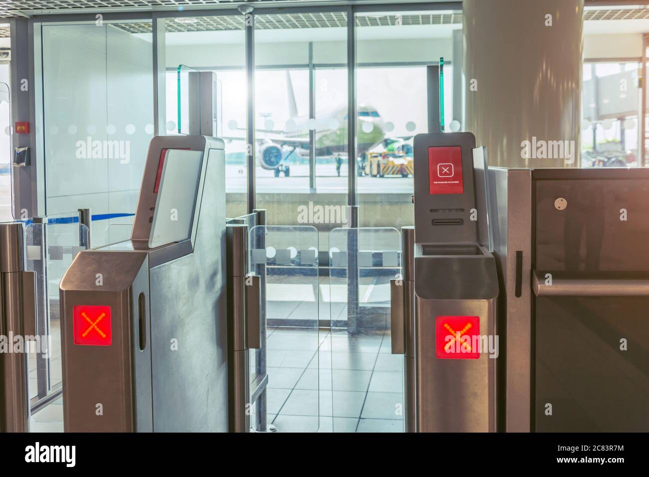 Red Cross the passage is closed sign Empty gateway terminal area in