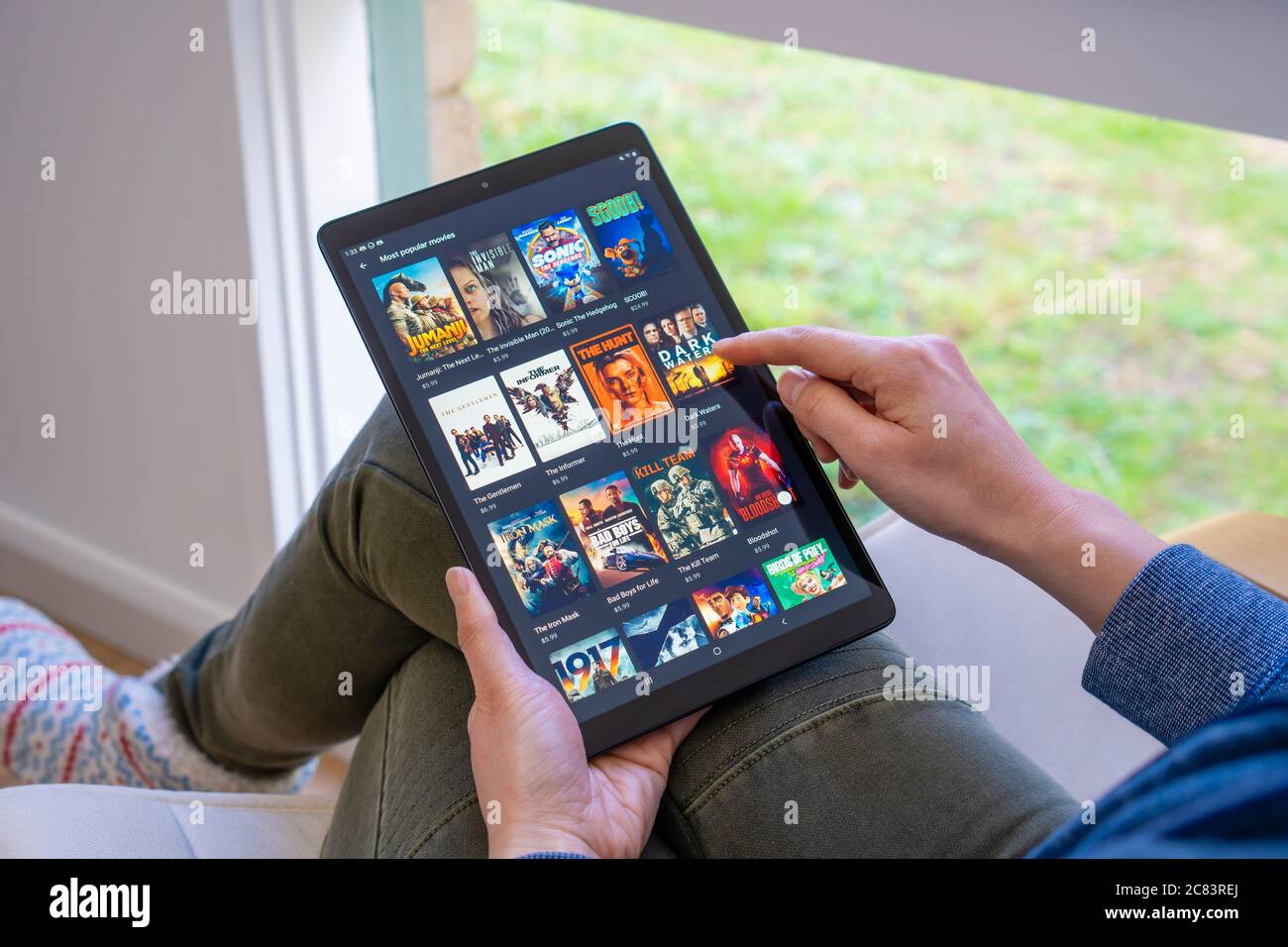 Browsing movies in Google Play Store Stock Photo