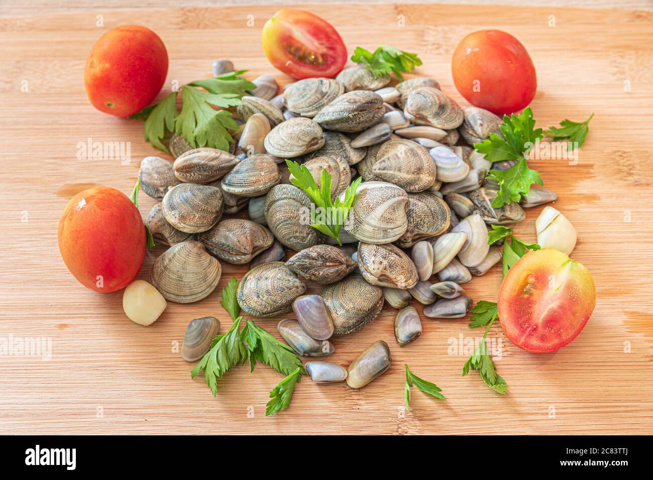 Naples, Italy. Food image of a bunch seafood. Lupins Clams and Pipi Cockles on a woody cutting board. Stock Photo