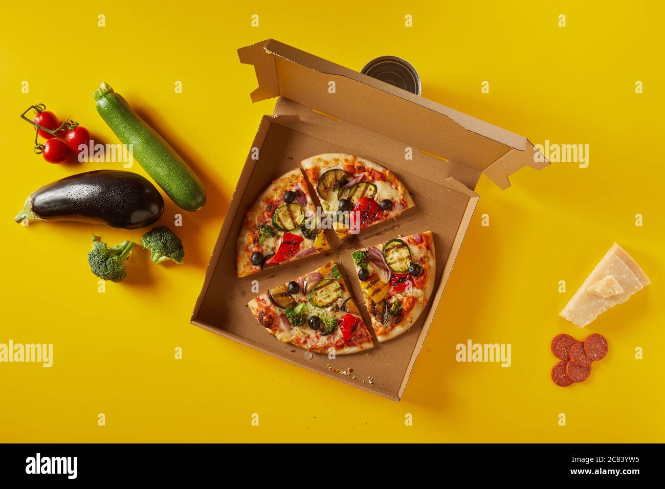 Tasty salami and vegetable Italian pizza with parmesan cheese and fresh