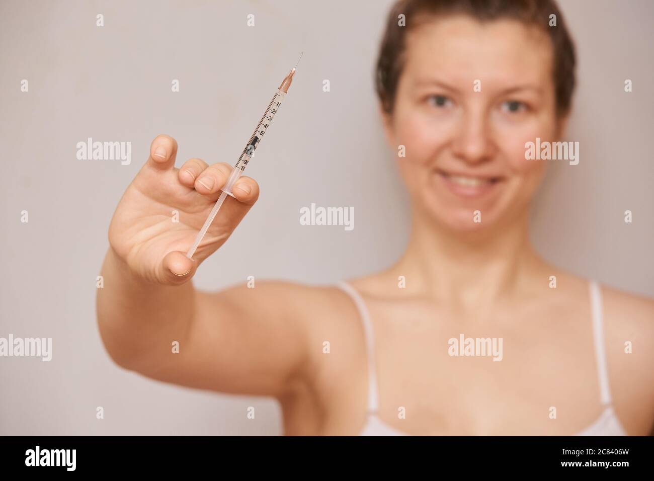 Girl hold insulin injection in hand. Blurred face Stock Photo Alamy