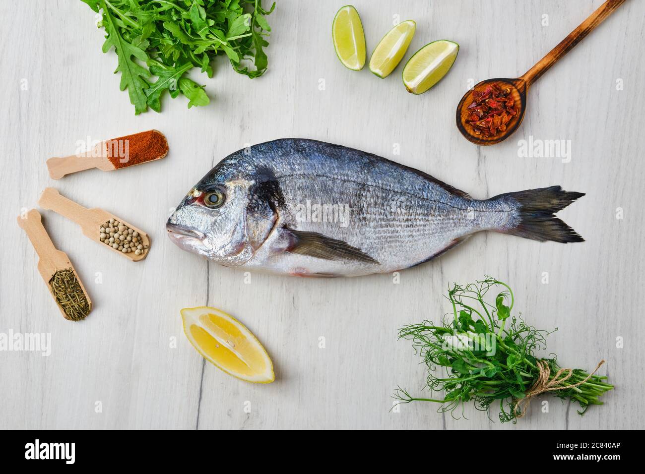 Dorada Fish On The Table With Spice And Herbs Stock Photo Alamy