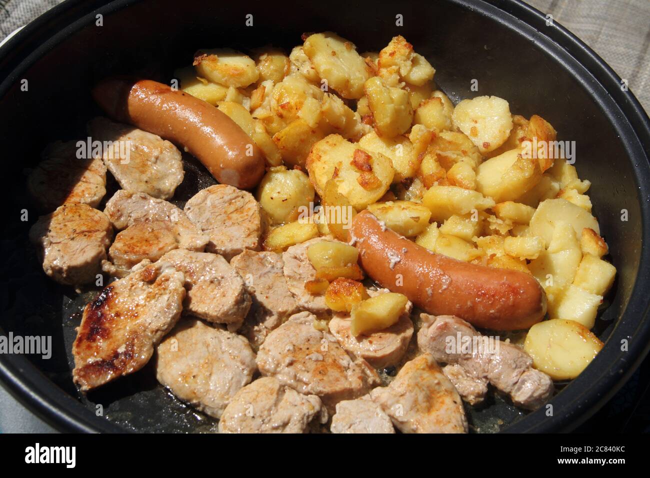 pork with sausage and potatoes Stock Photo Alamy