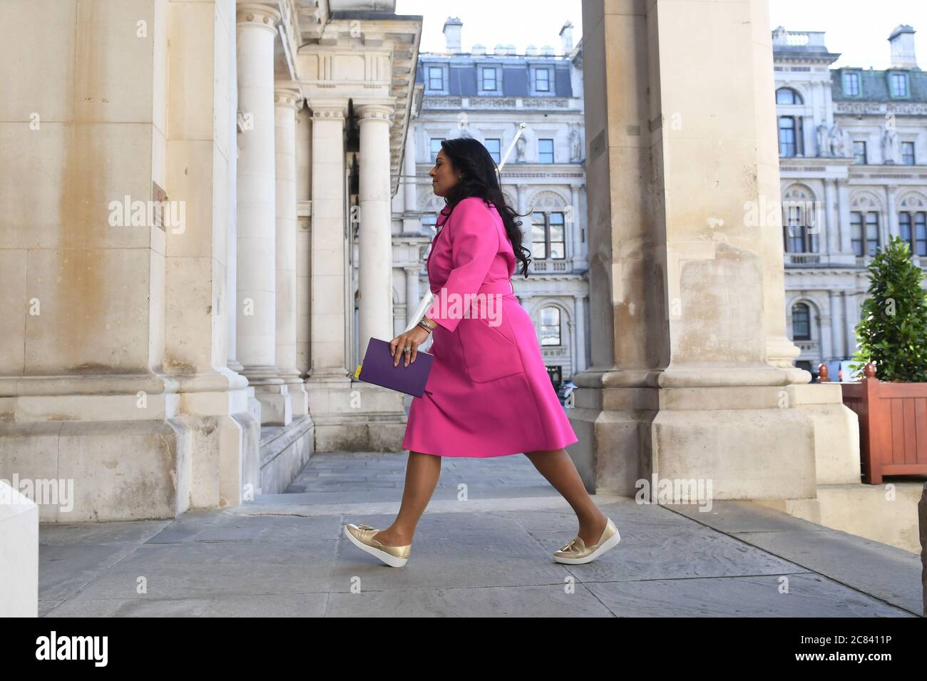 priti patel pink dress London, UK. 3rd June, 2022. Priti Patel, home secretary, leaves, next to Ben Wallace looking slightly awkward