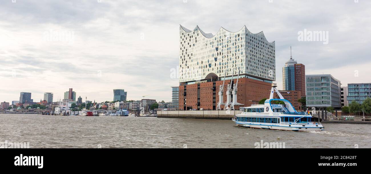 Panorama of Elbe river with Elbphilharmonie and a public ferry. Stock Photo