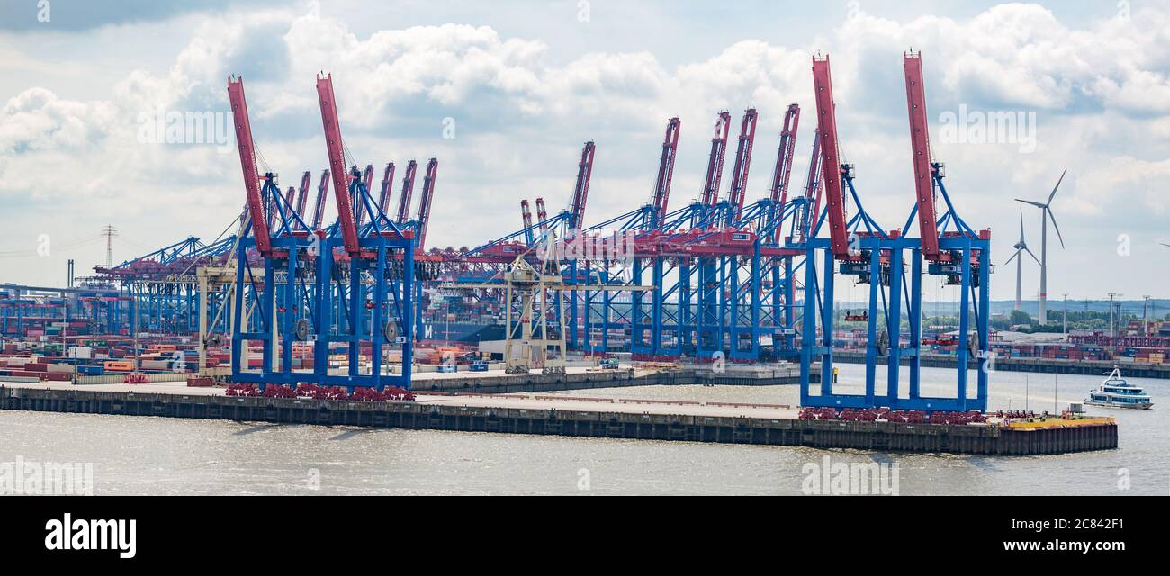 Container terminal with harbor cranes. Dock at Hamburger Hafen (port of Hamburg). Stock Photo