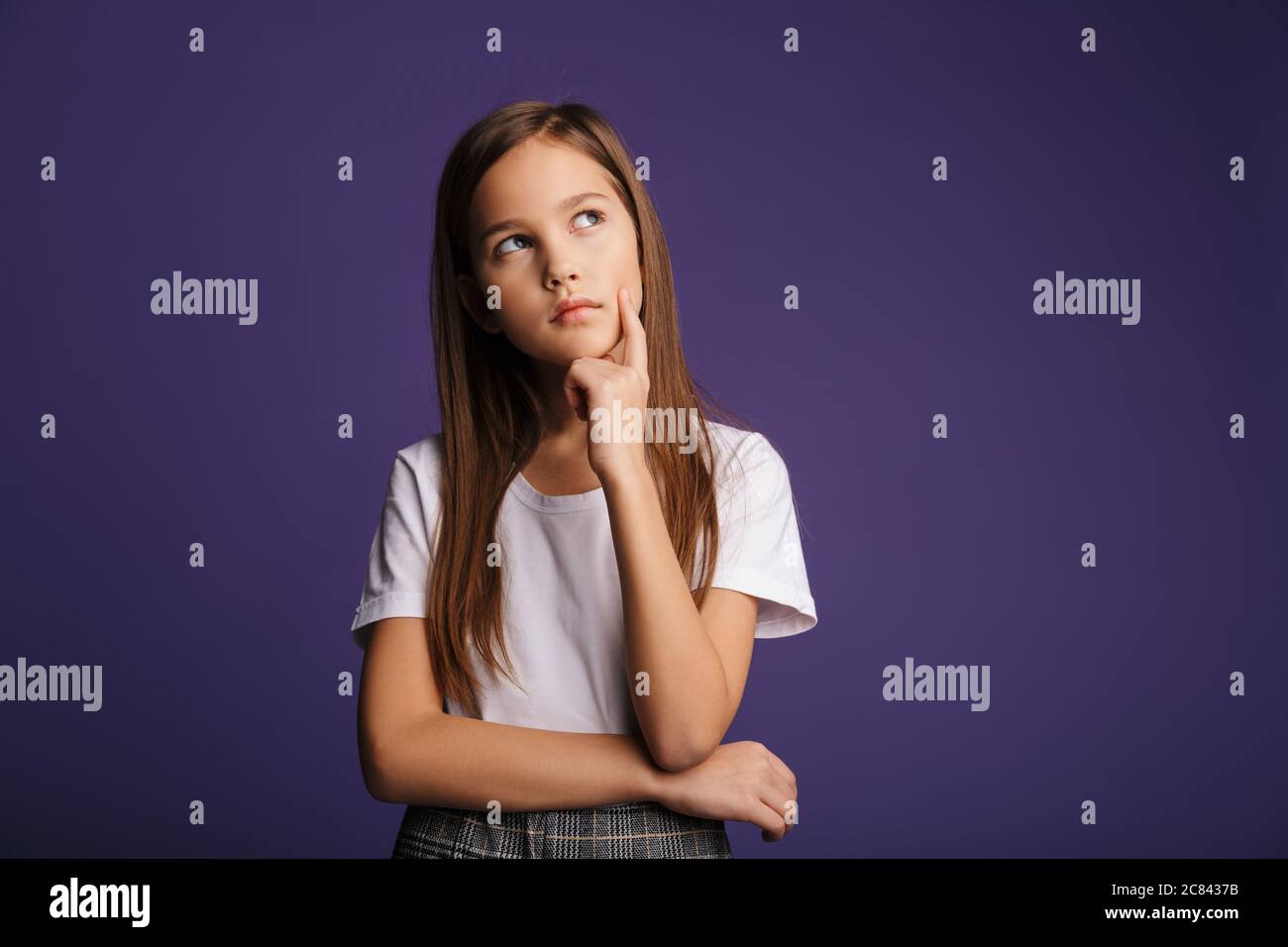 Photo of thinking beautiful girl posing and looking upward isolated ...