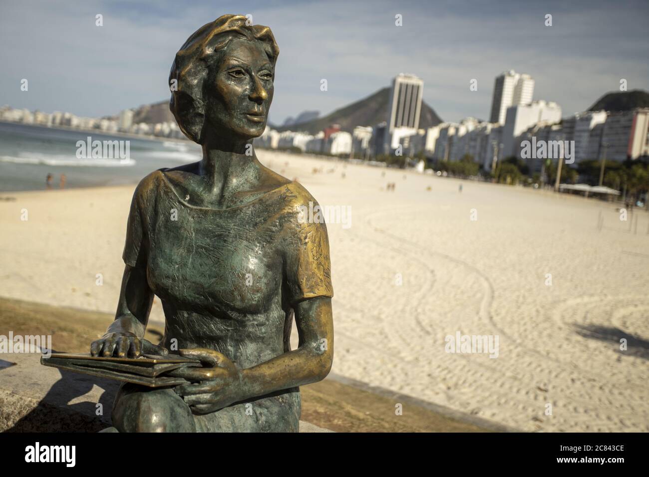 RIO DE JANEIRO, BRAZIL - Jul 12, 2020: Bronze statue of Clarice Lispector, Ukranian journalist and writer with Copacabana beach in the background Stock Photo