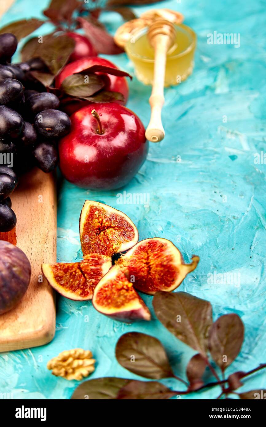 Autumn food still life with season fruits grape, red apples and figs ...