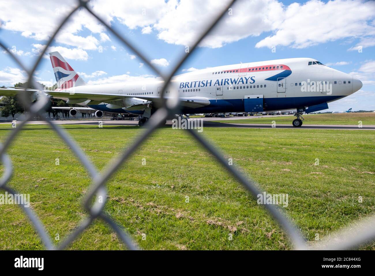 British Airways has recently announced the retirement of it's fleet of 747 aircraft, a decision brough forward due to the impact of the Coronavirus pandemic. This BA 747 is parked at Kemble airfield, Gloucestershire with It's engines allready removed. Based at the airfield 'Air Salvage international' dissasemble aircrfat for parts and scrap materials. Stock Photo