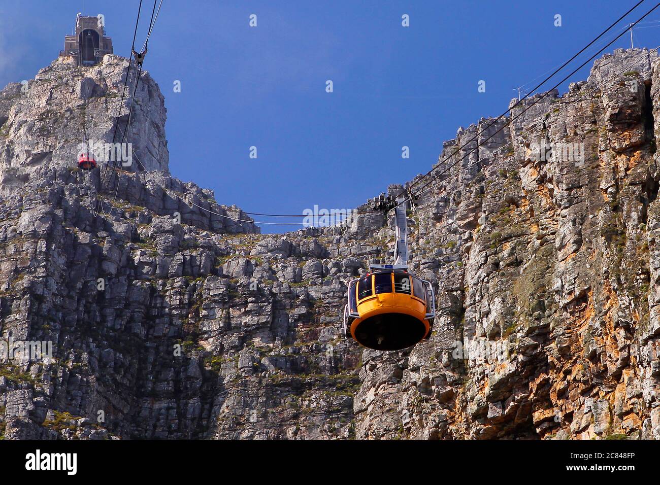 Both the Table Mountain cablecars seen going up and down Table