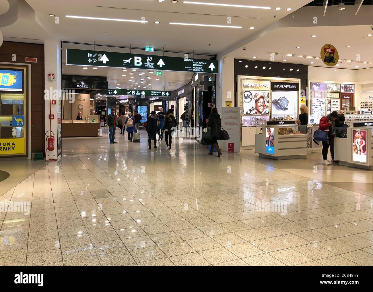 Ferno, Milan-Malpensa, Italy - February 8, 2020: Interiors with shops and bars in the Terminal 1 of Milan-Malpensa International Airport. Stock Photo