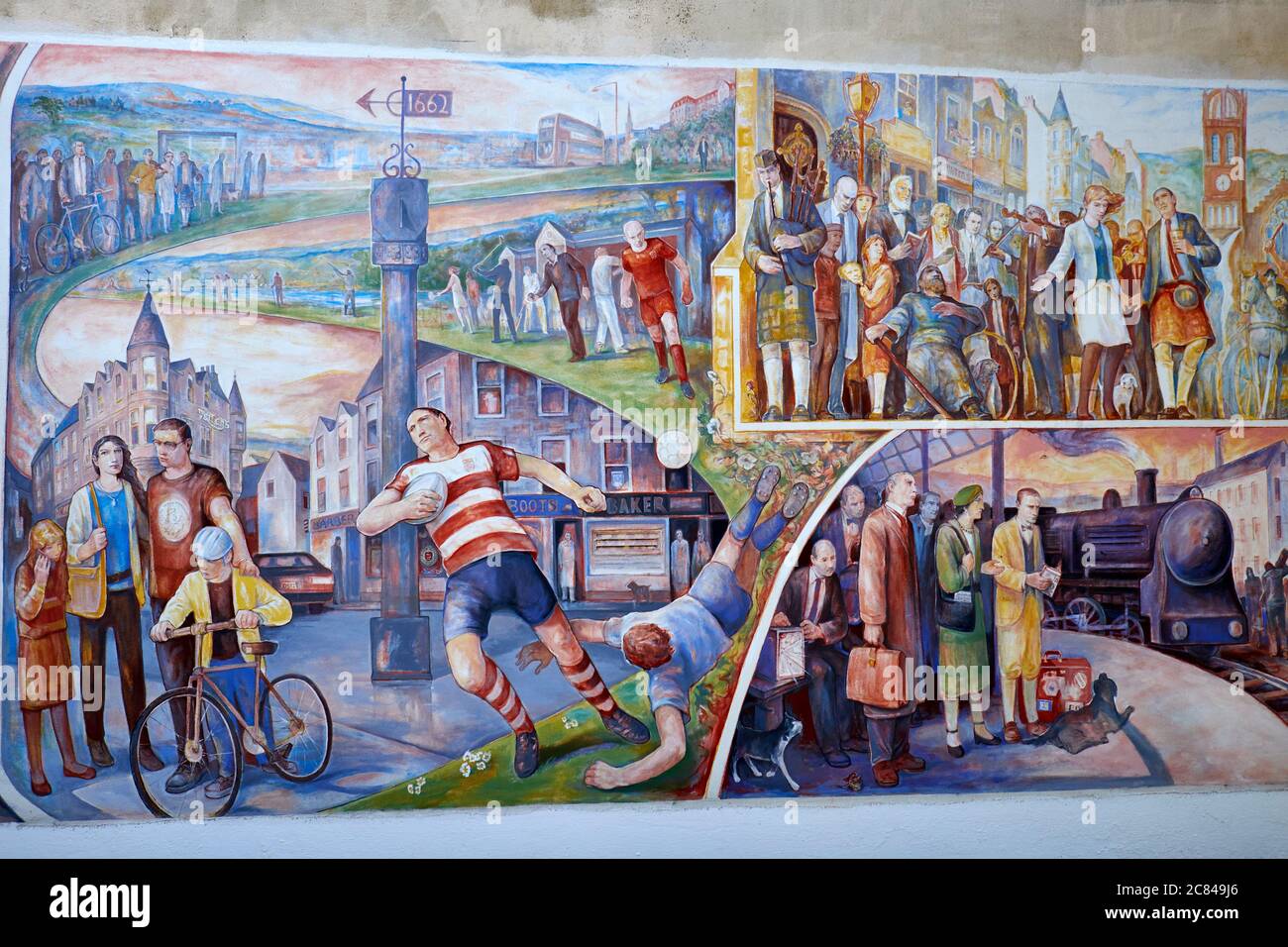 Wall mural painted by Michael Jessing portraying the town of Peebles cultural history dating from the year 1200 up to the present day. Stock Photo