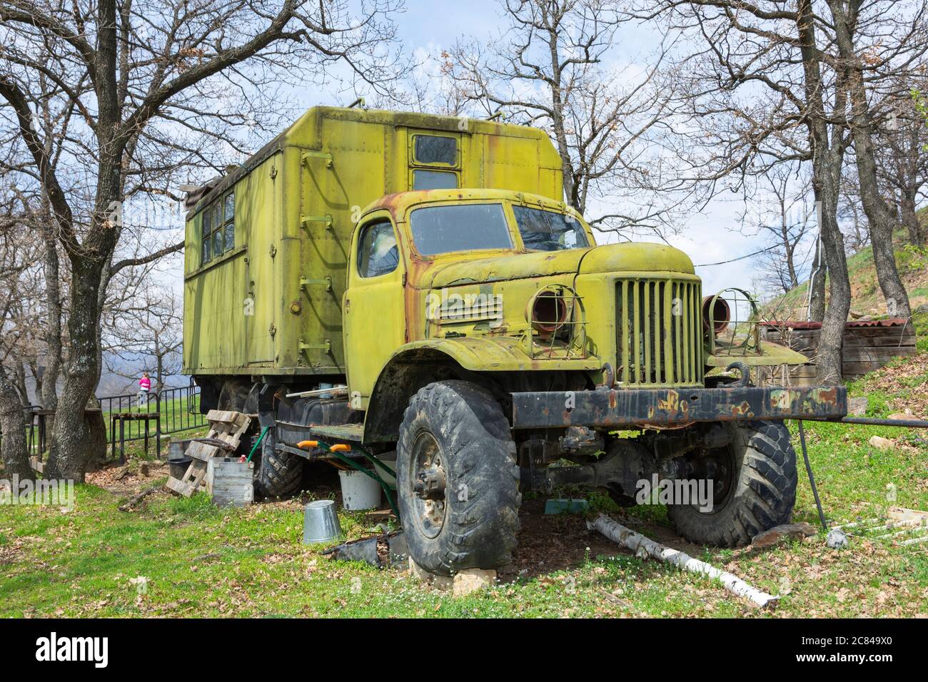 Old russian military truck Zil abandoned in nature. Retro vehicle. Stock Photo