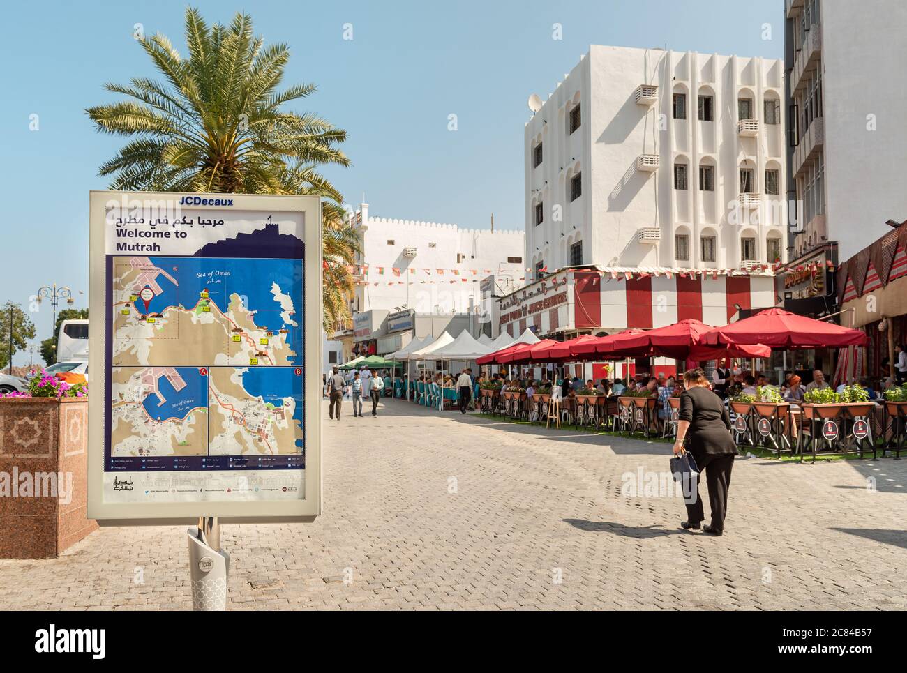 Mutrah, Oman - February 10, 2020: People enjoying a outdoor bars and restaurants in the center of Mutrah in a hot day, province of Muscat, Sultanate o Stock Photo