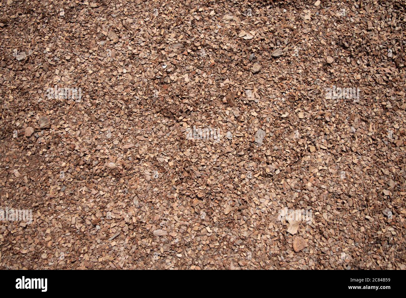 Background of seamless tiling wood chips used for safety in toddlers playgrounds. Stock Photo