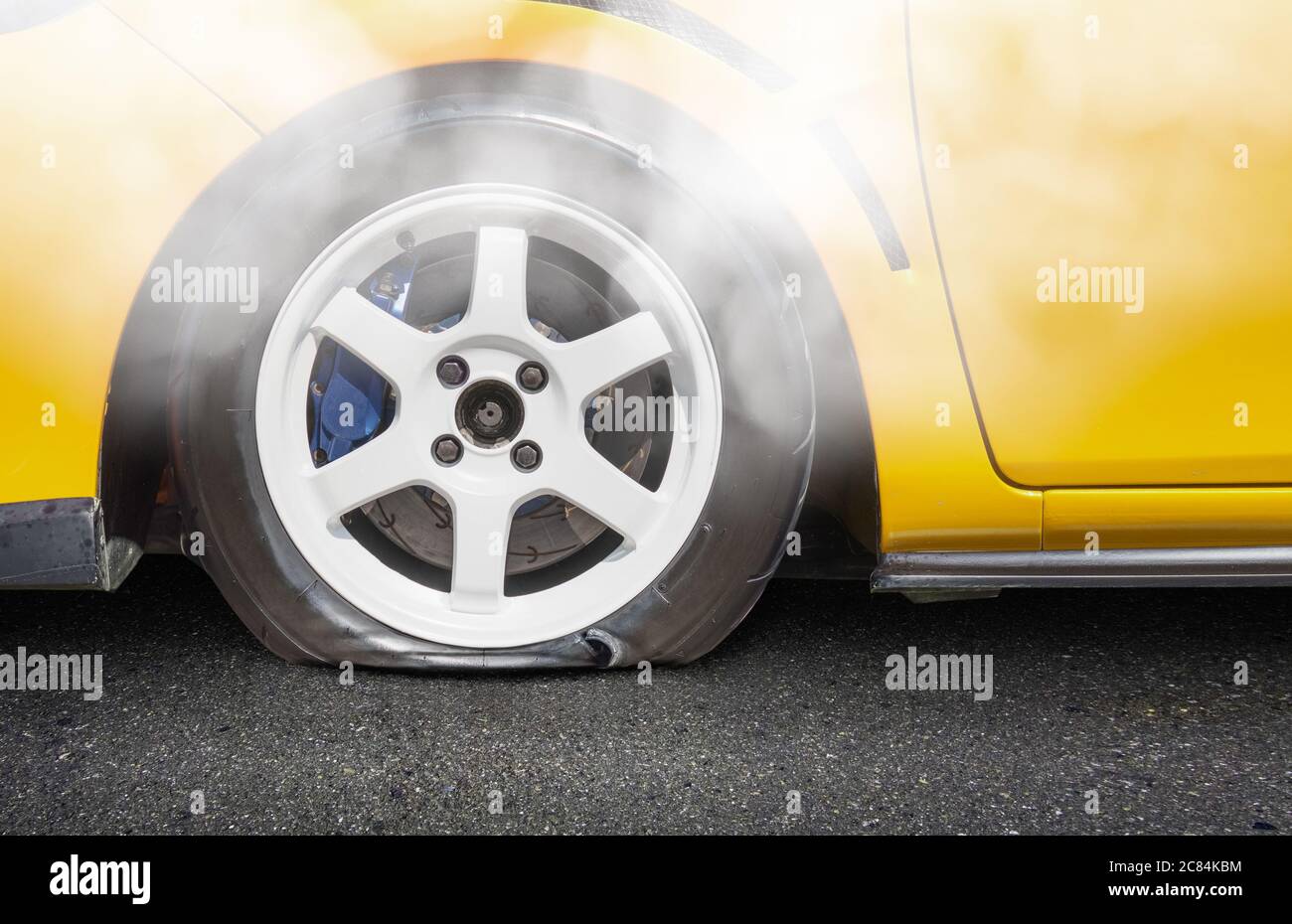 burst car tire on road Stock Photo Alamy