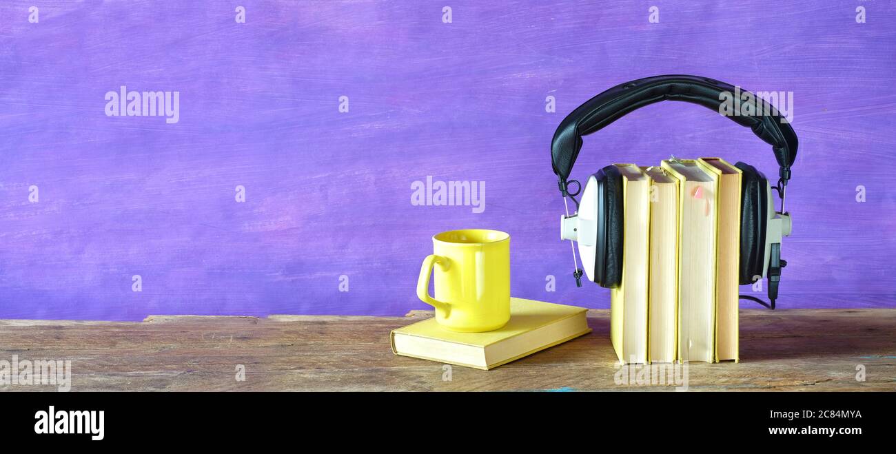 audio books, books and heaphones, entertainment and education concept, panorama format, large copy space Stock Photo