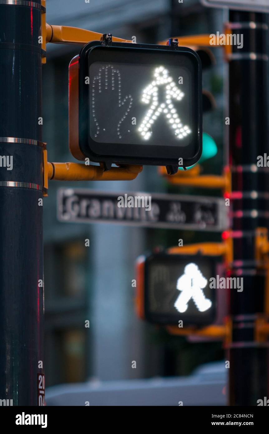 Pedestrian crosswalk signals, Granville Street, Vancouver, British Columbia, Canada. Stock Photo
