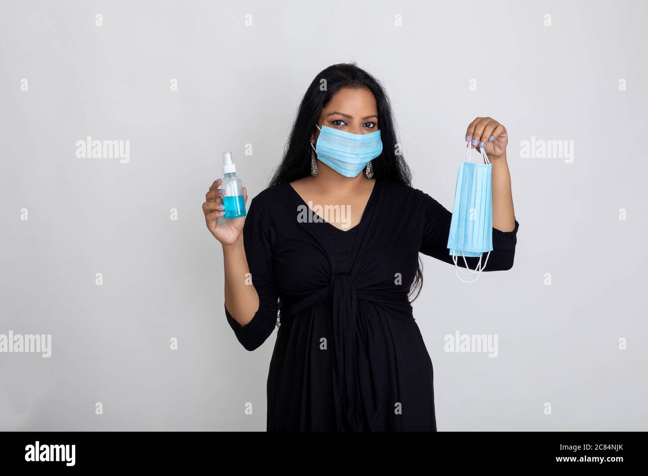 Indian woman wearing Covid protection mask, Lady displays mask and