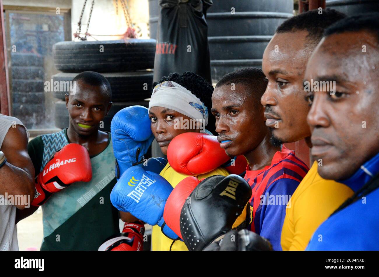 Dar Es Salaam. 21st July, 2020. Female boxer Jesca Mfinanga (4th R) poses  with her male teammates at a boxing club in Dar es Salaam, Tanzania, on  July 20, 2020. Jesca Mfinanga,