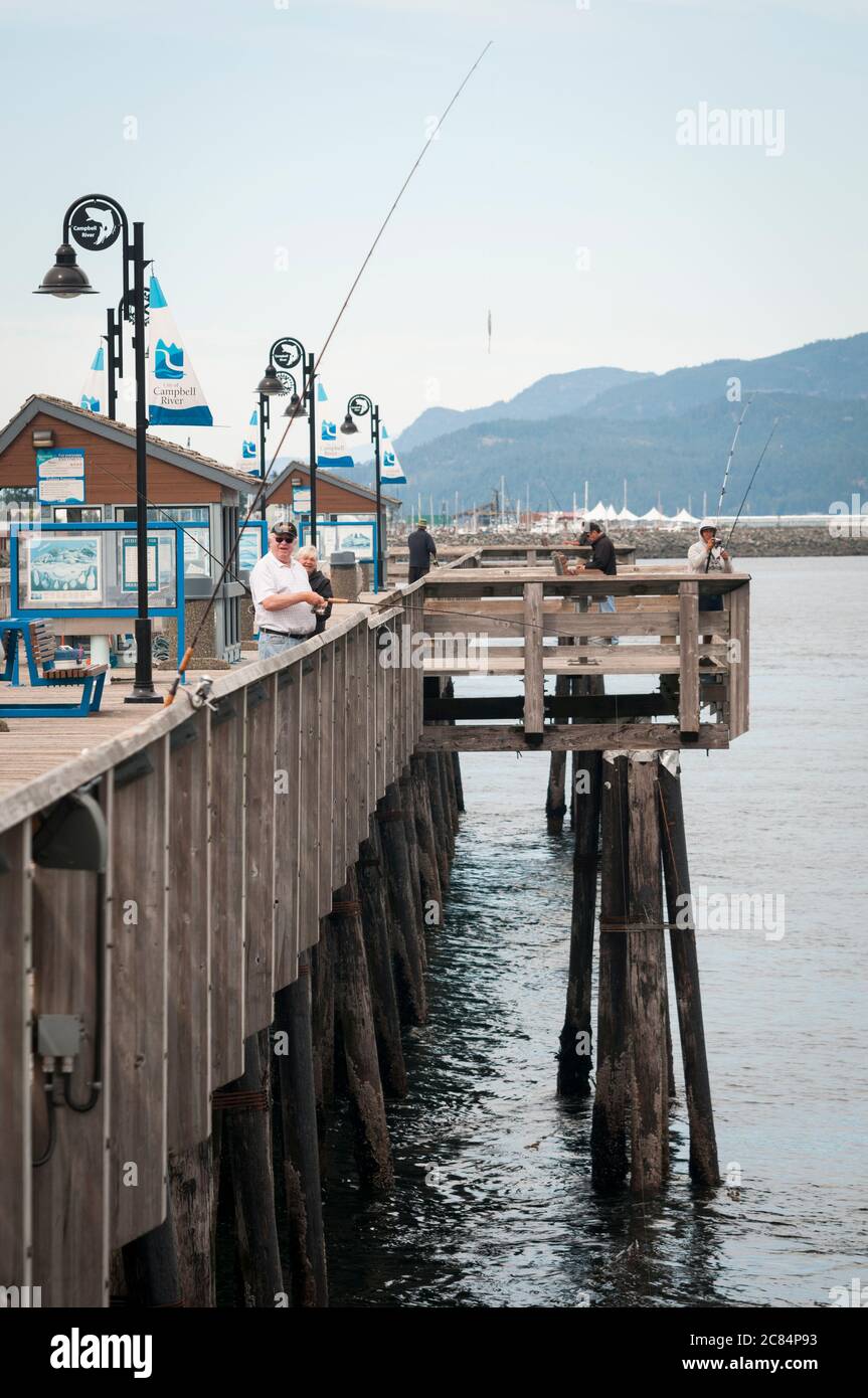 Anglers fishing off Fisherman's Wharf, Campbell River, Vancouver Island, British Columbia, Canada. Stock Photo