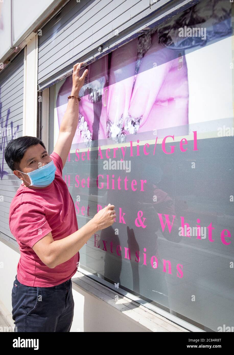 Bau Van Pham, manager of Nails and Spa on Croall Place, Edinburgh, cleans and makes preparations before the salon reopens on Wednesday July 22 as Scotland prepares for the lifting of further coronavirus lockdown restrictions. Stock Photo