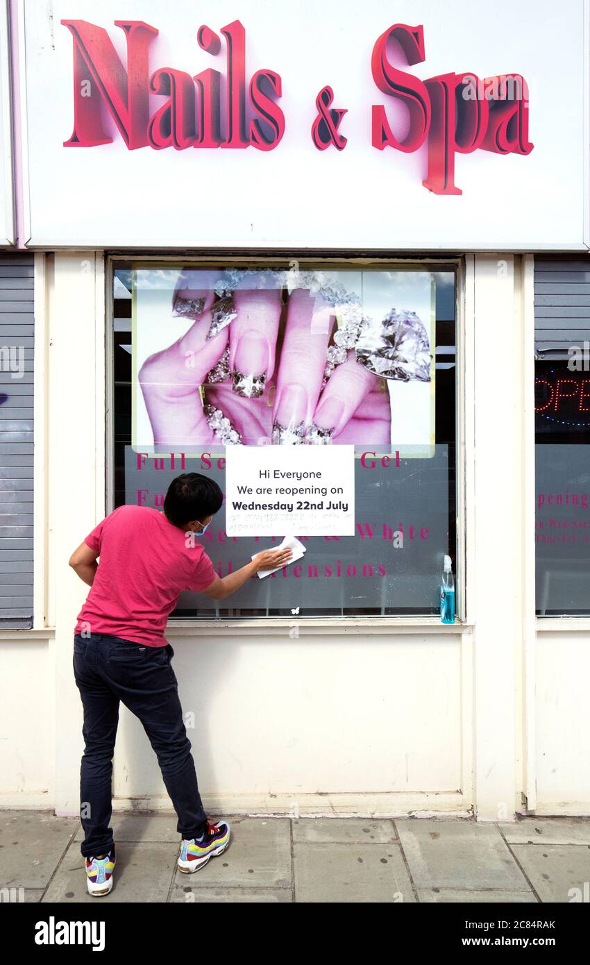 Bau Van Pham, manager of Nails and Spa on Croall Place, Edinburgh, cleans and makes preparations before the salon reopens on Wednesday July 22 as Scotland prepares for the lifting of further coronavirus lockdown restrictions. Stock Photo
