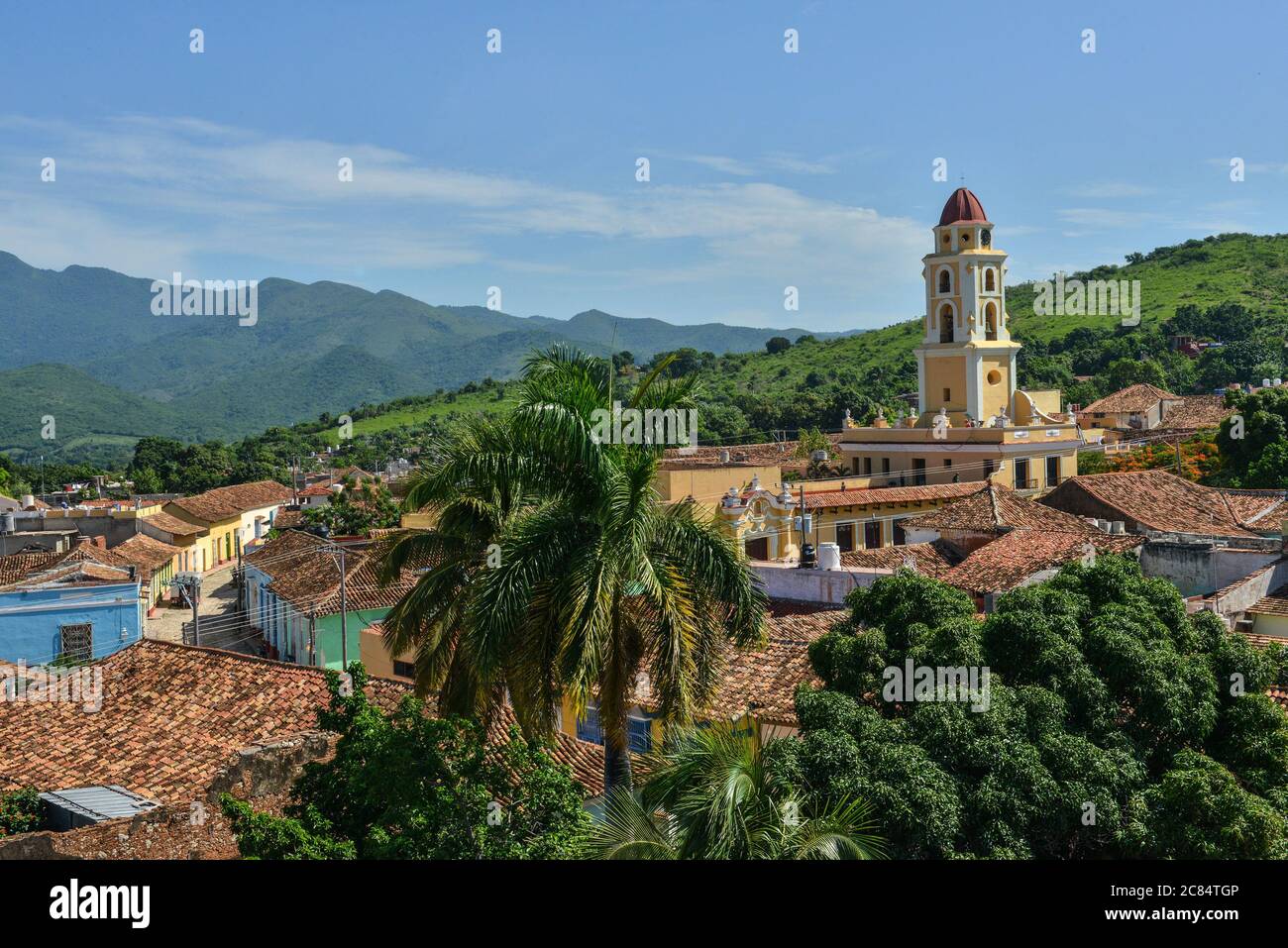 Cuba, Sancti Spiritus Province: Trinidad. Overview of the tiled roofs of houses in the city and the bell tower of the Church of Francis of Assisi (Igl Stock Photo