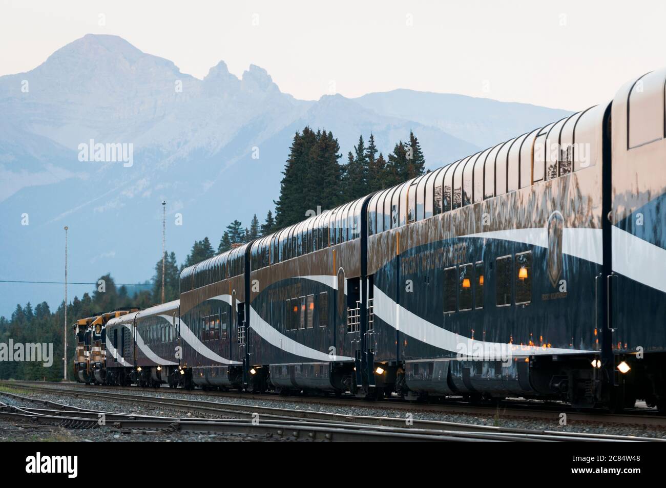 The Rocky Mountaineer train with Mount Girouard behind, Banff railroad station, Alberta, Canada. Stock Photo