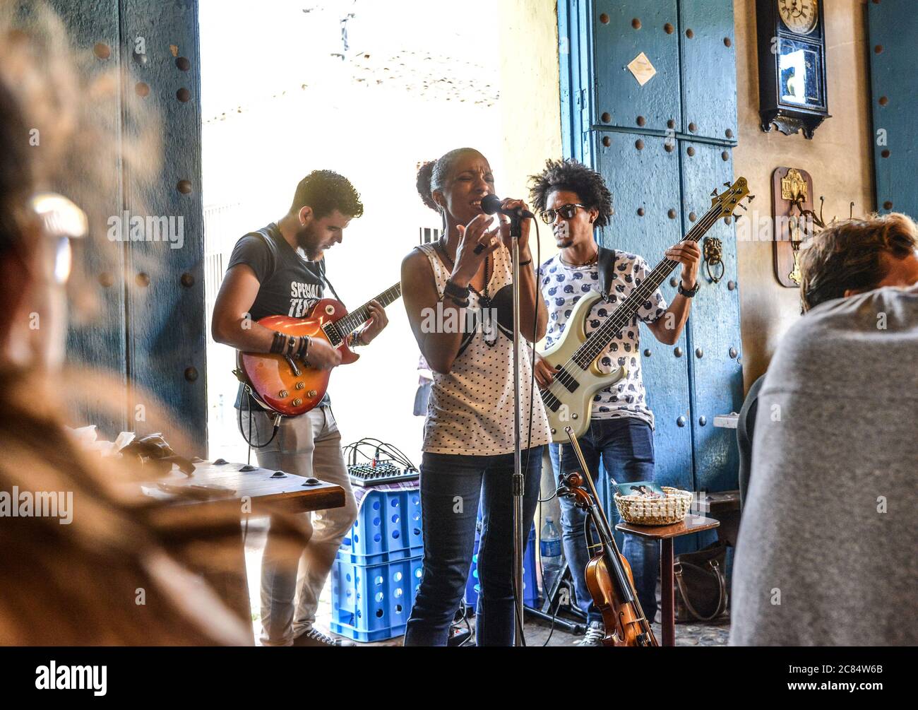 Cuba, Trinidad: Cuban band in a bar. Mixed-race singer, guitarist and bassist. Young musicians Stock Photo