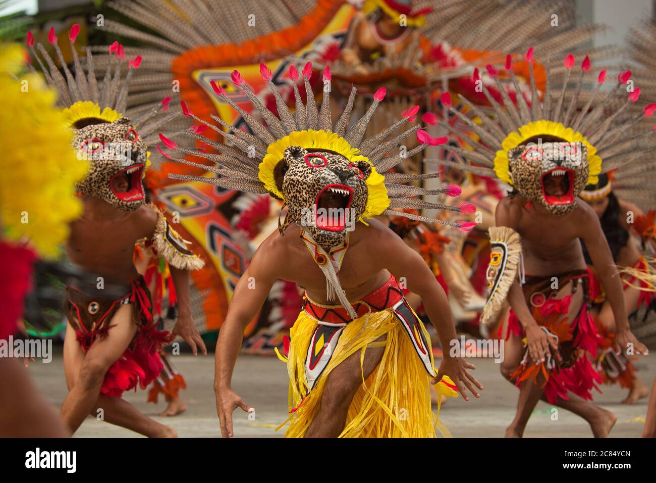 Male dancers in exotic jaguar animal costumes & headdresses perform in