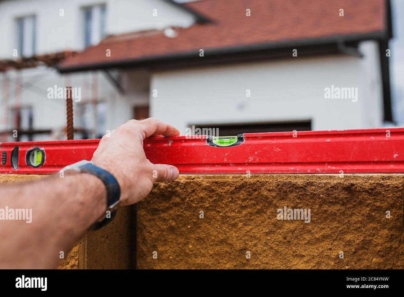 Quality control of stone wall construction with manual building level